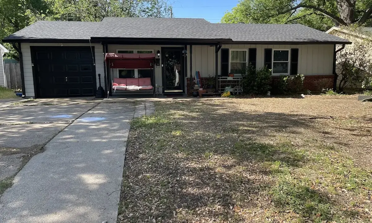 Asphalt Shingle Roof Repair crew at work on a residential roof in Harvey